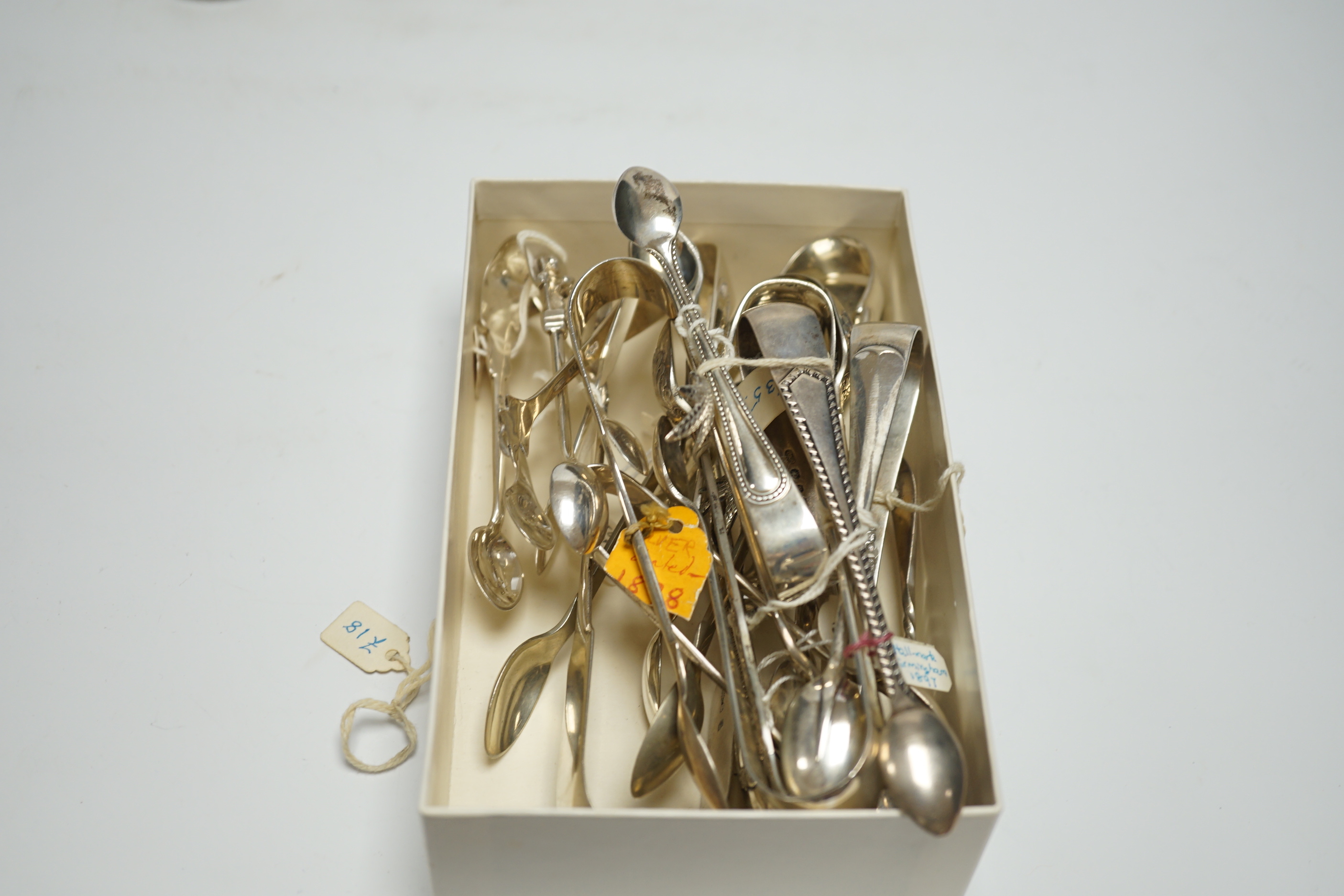 A pair of 18th century Irish silver sugar nips, together with sixteen later mainly 20th century silver sugar nips, various dates and makers, eight plated pairs and a small silver toasting? fork.